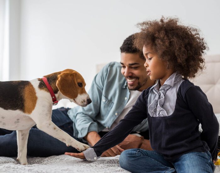 Father with daughter and puppy